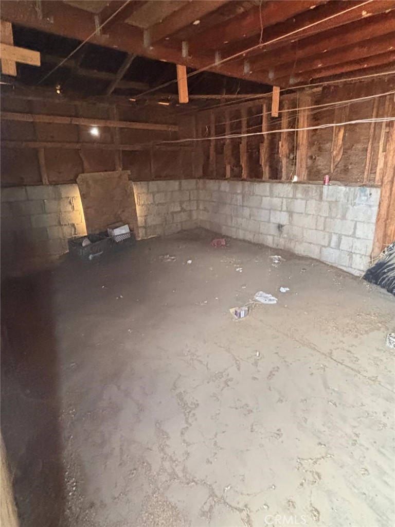 15032 Birch Street Hesperia, CA 92345 - Photo 18 of 21 a view of a room with wooden shelves