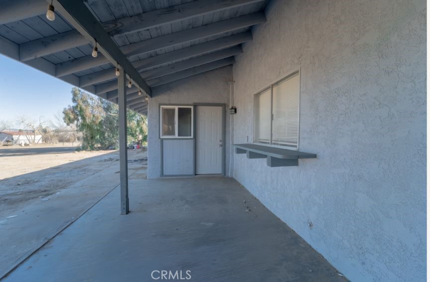 15032 Birch Street Hesperia, CA 92345 - Photo 4 of 21 a view of a house with a porch