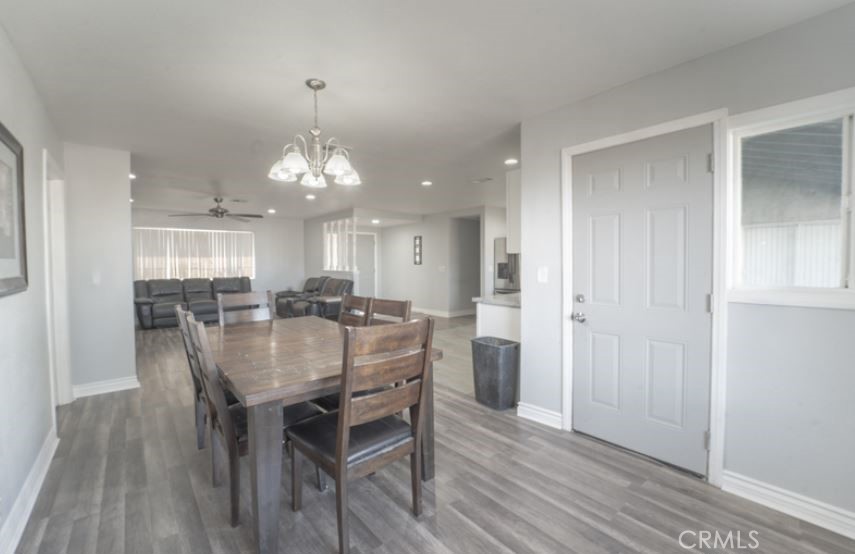 15032 Birch Street Hesperia, CA 92345 - Photo 5 of 21 a view of a dining room with furniture and wooden floor
