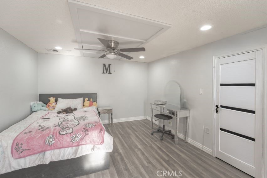 15032 Birch Street Hesperia, CA 92345 - Photo 9 of 21 a bedroom with bed and a window