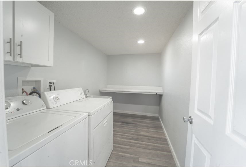 15032 Birch Street Hesperia, CA 92345 - Photo 10 of 21 a view of storage and utility room with washer and dryer