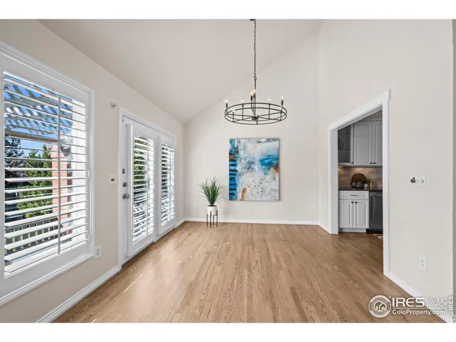 a view of a livingroom with furniture and a kitchen