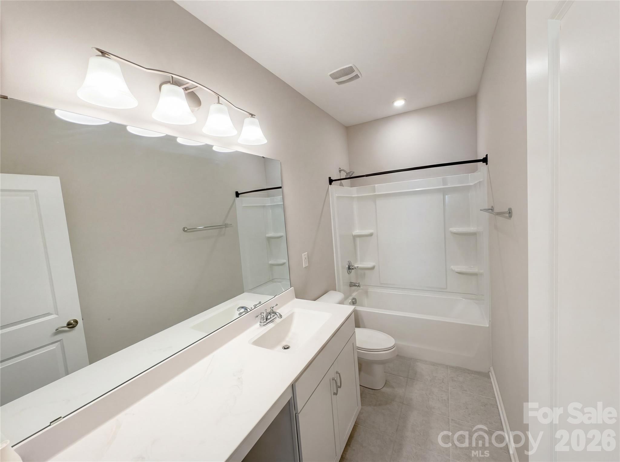 617 Ardsley Drive Locust, NC 28097 - Photo 10 of 23 a bathroom with a sink a toilet and shower