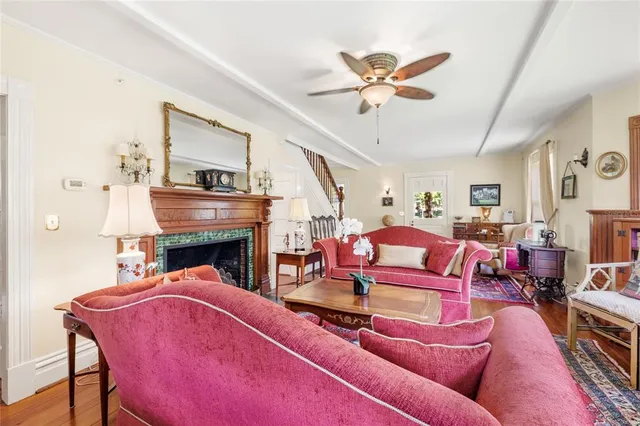 a view of a dining room with furniture wooden floor and a chandelier