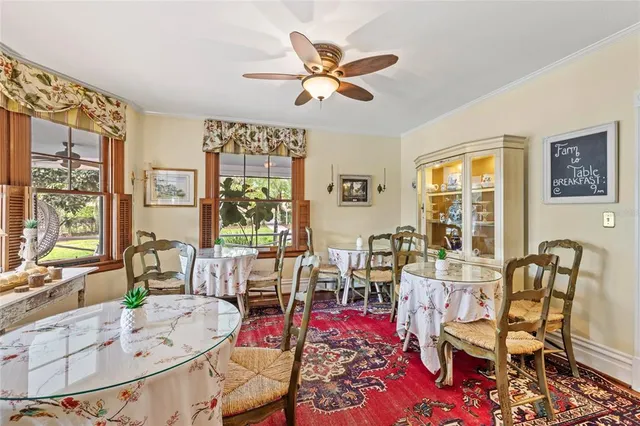 a view of a chairs and a table in the balcony