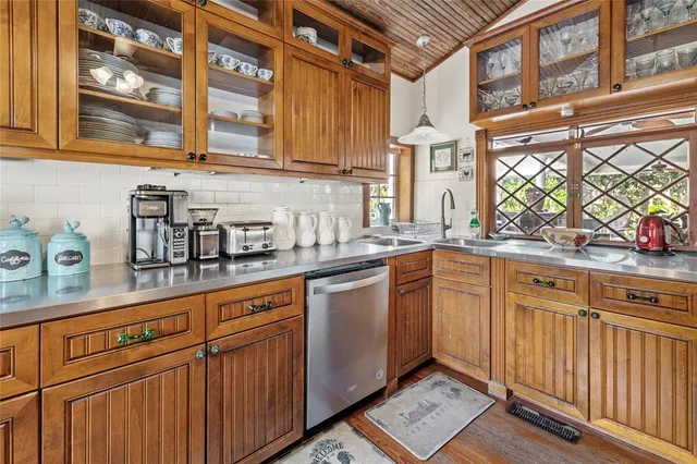 a bathroom with a sink a mirror and shower