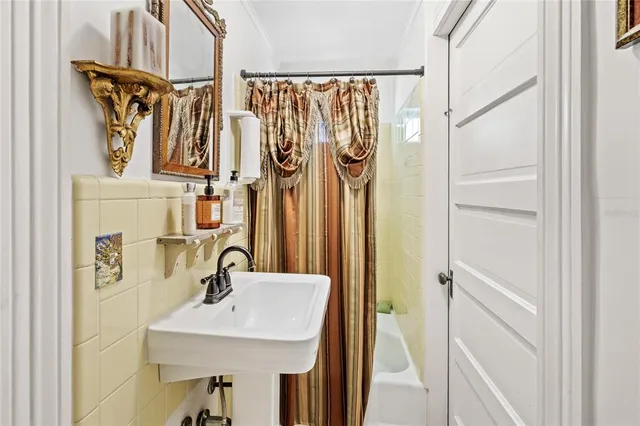 a bathroom with a sink mirror vanity and toilet
