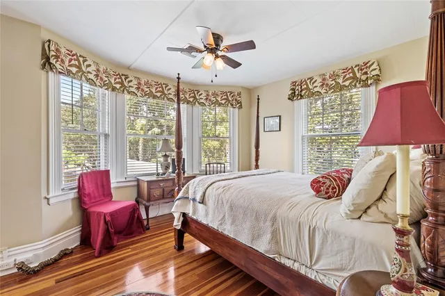 a bathroom with a sink vanity mirror and toilet
