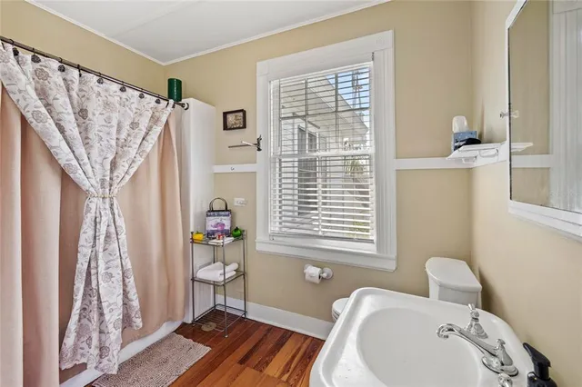 a view of living room with furniture and wooden floor