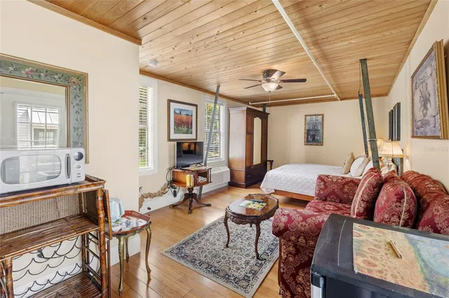 a view of a house with swimming pool and porch with furniture
