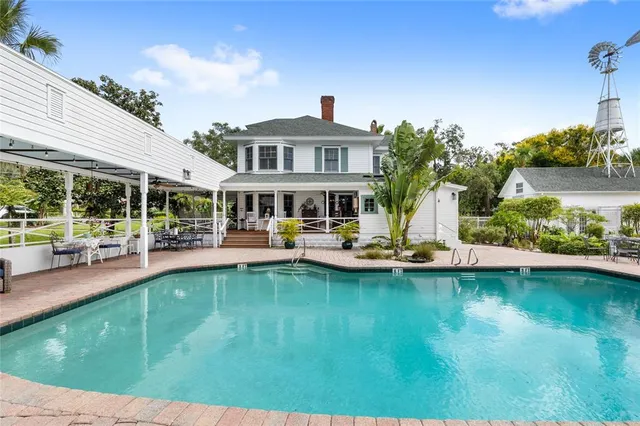 a view of a livingroom with furniture and a window