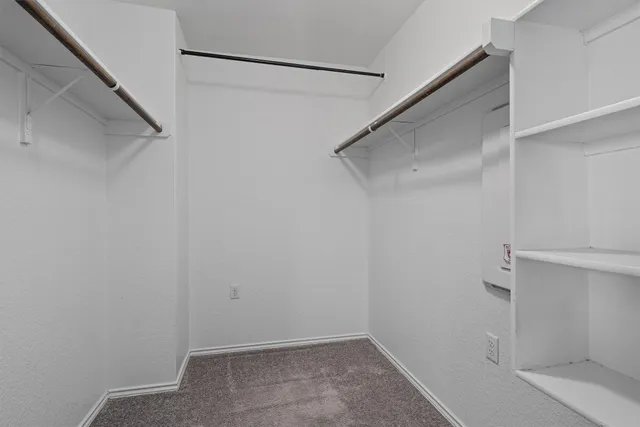 a view of an empty walk in closet