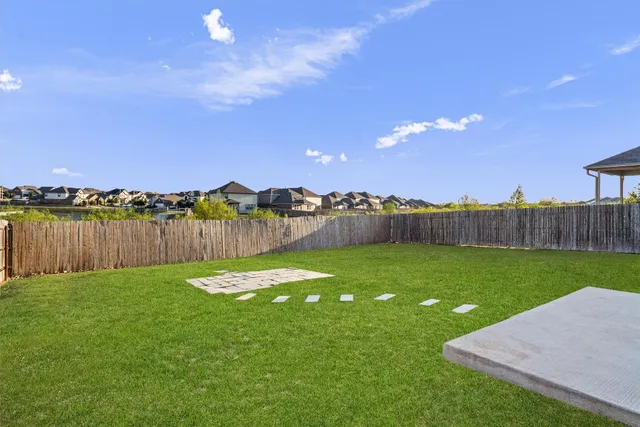 a view of a yard and ocean view