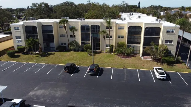 a view of a house with pool porch and outdoor seating