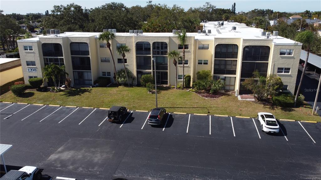 a view of a house with pool porch and outdoor seating