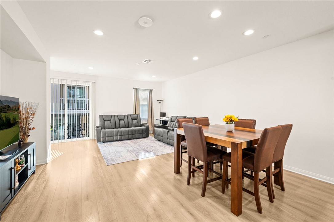 8633 Amherst Street Santee, CA 92071 - Photo 19 of 61 a view of a dining room with furniture and wooden floor