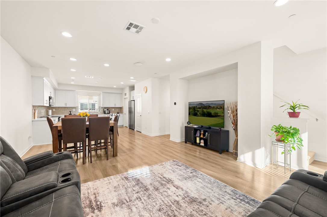 8633 Amherst Street Santee, CA 92071 - Photo 23 of 61 a living room with furniture and a flat screen tv