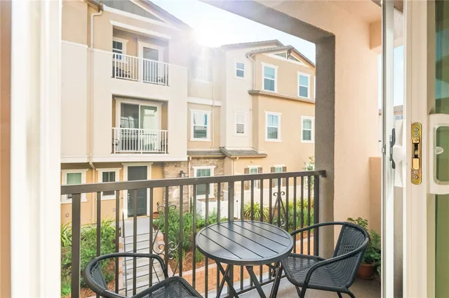 a bedroom with a bed and painting on the wall