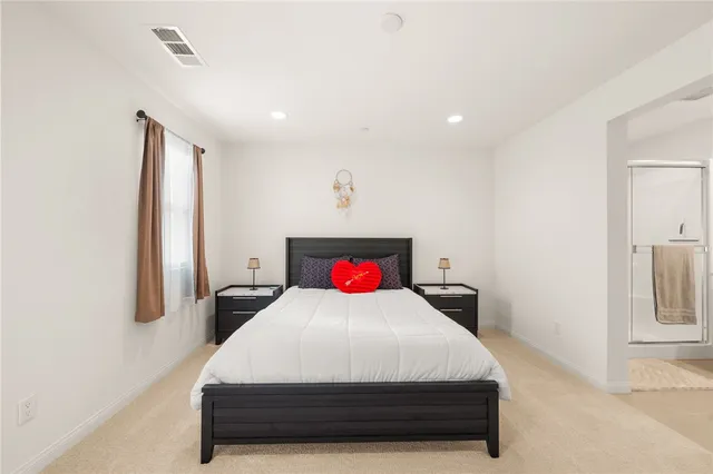 a bathroom with double sink and a mirror