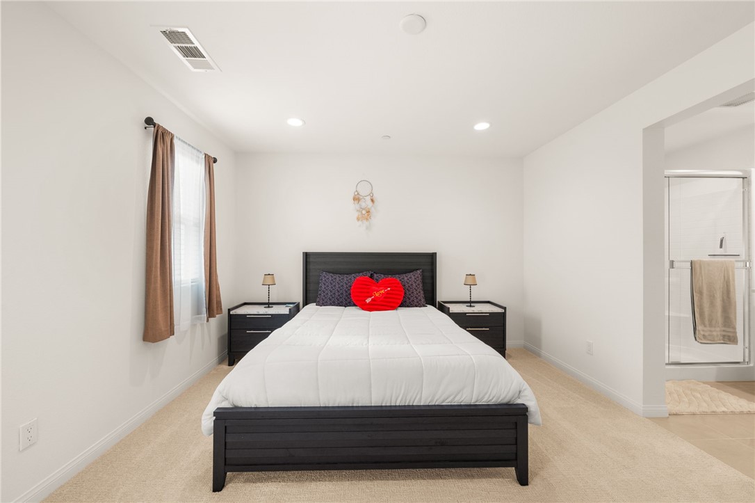 8633 Amherst Street Santee, CA 92071 - Photo 32 of 61 a bedroom with a bed and painting on the wall