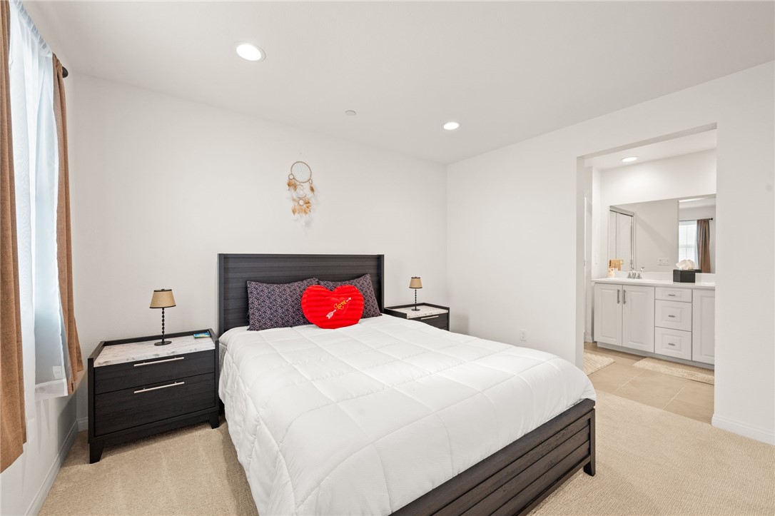 8633 Amherst Street Santee, CA 92071 - Photo 33 of 61 a bedroom with a bed and a view of kitchen