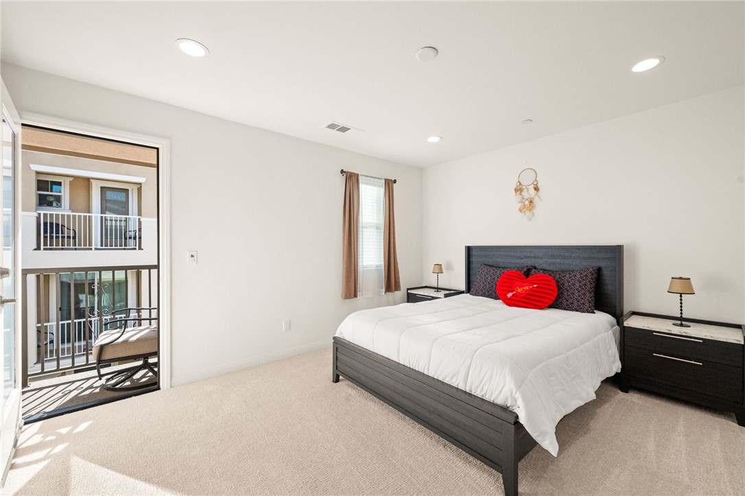8633 Amherst Street Santee, CA 92071 - Photo 34 of 61 a bedroom with a bed and a large window