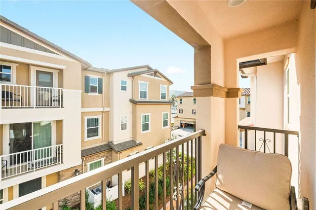 a large bed sitting in a bedroom and a table