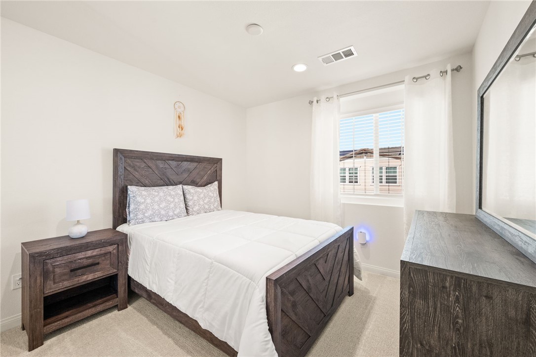 8633 Amherst Street Santee, CA 92071 - Photo 44 of 61 a bedroom with a bed and a window
