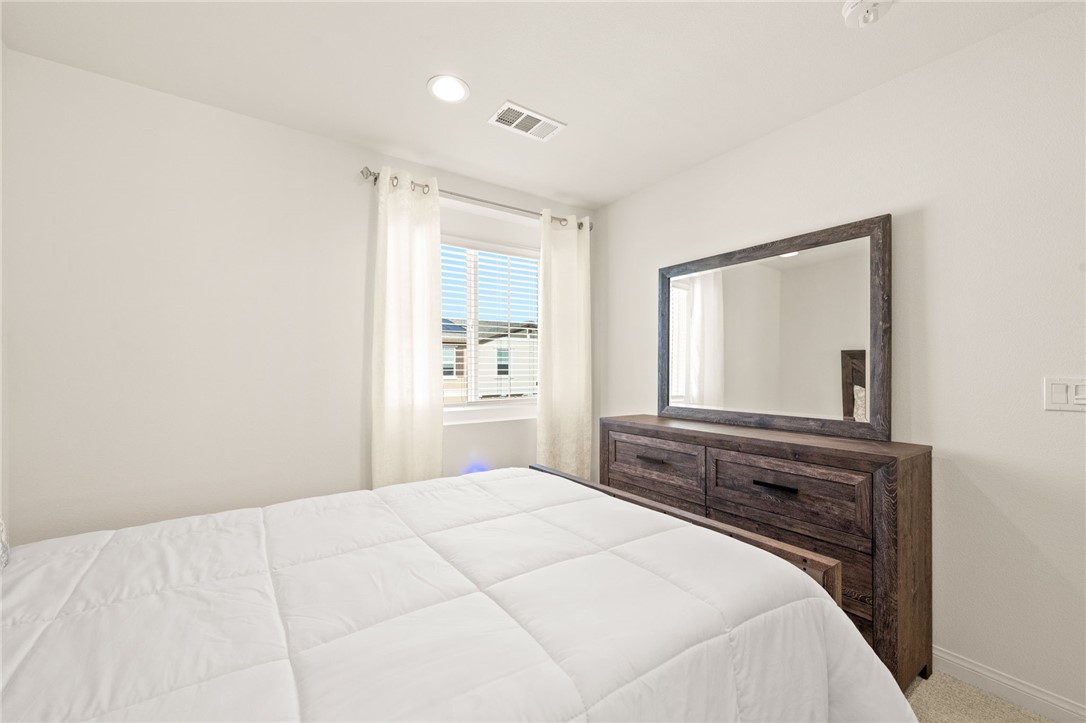 8633 Amherst Street Santee, CA 92071 - Photo 46 of 61 a bedroom with a bed and a window