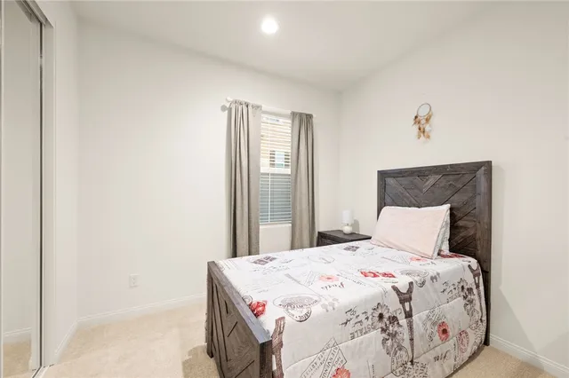 a bedroom with a bed and a dresser