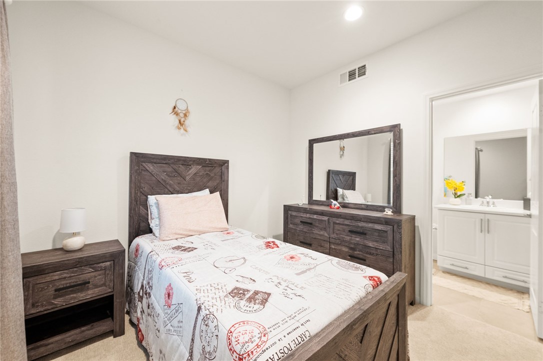 8633 Amherst Street Santee, CA 92071 - Photo 6 of 61 a bedroom with a bed and a dresser