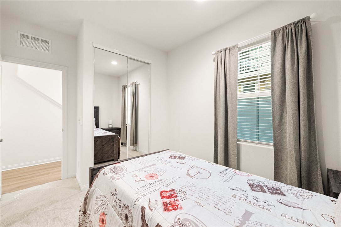 8633 Amherst Street Santee, CA 92071 - Photo 8 of 61 a bedroom with a bed and a window