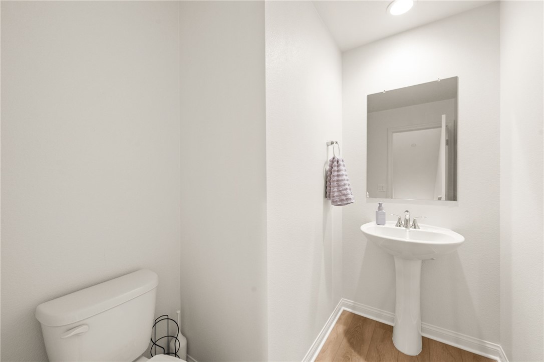 8633 Amherst Street Santee, CA 92071 - Photo 10 of 61 a bathroom with a sink a toilet and a mirror