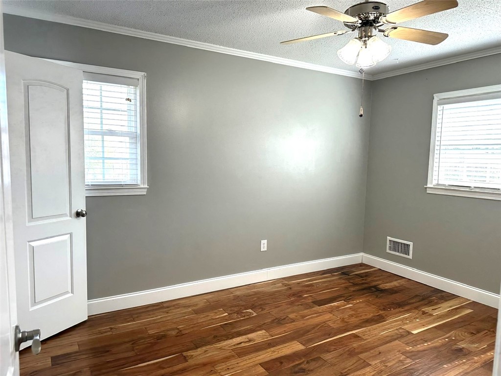 209 Keystone Drive Anderson, SC 29621 - Photo 12 of 20 Bright and airy room featuring warm wooden floors and inviting natural light.