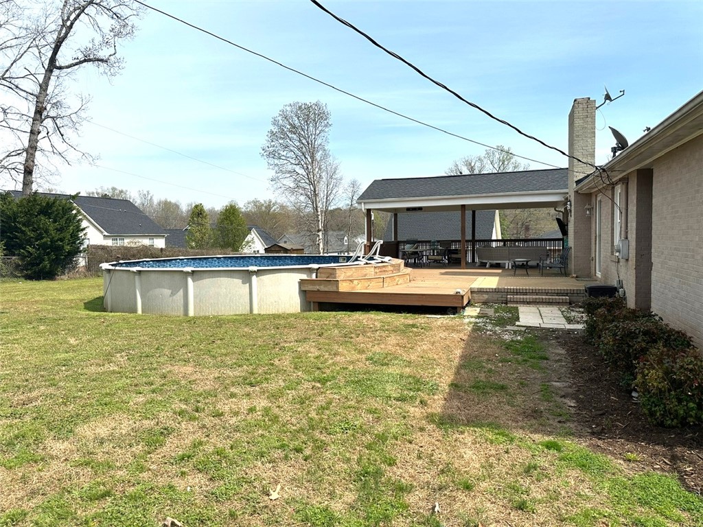 209 Keystone Drive Anderson, SC 29621 - Photo 15 of 20 This residence features a backyard oasis with a refreshing pool and an expansive deck for outdoor enjoyment.