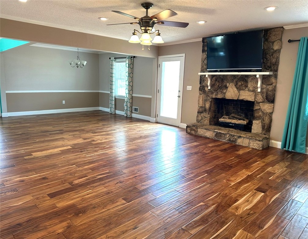 209 Keystone Drive Anderson, SC 29621 - Photo 4 of 20 This expansive living area features lustrous wood flooring and a commanding stone fireplace.