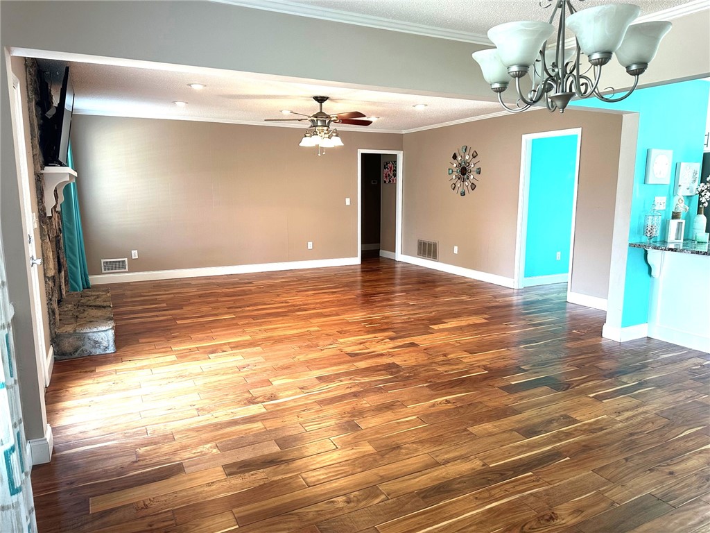 209 Keystone Drive Anderson, SC 29621 - Photo 6 of 20 This expansive living space features rich hardwood flooring and a stone fireplace.