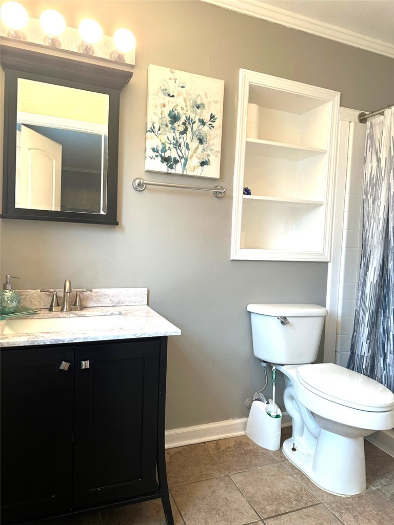 209 Keystone Drive Anderson, SC 29621 - Photo 9 of 20 This functional bathroom provides essential amenities for comfortable daily routines.