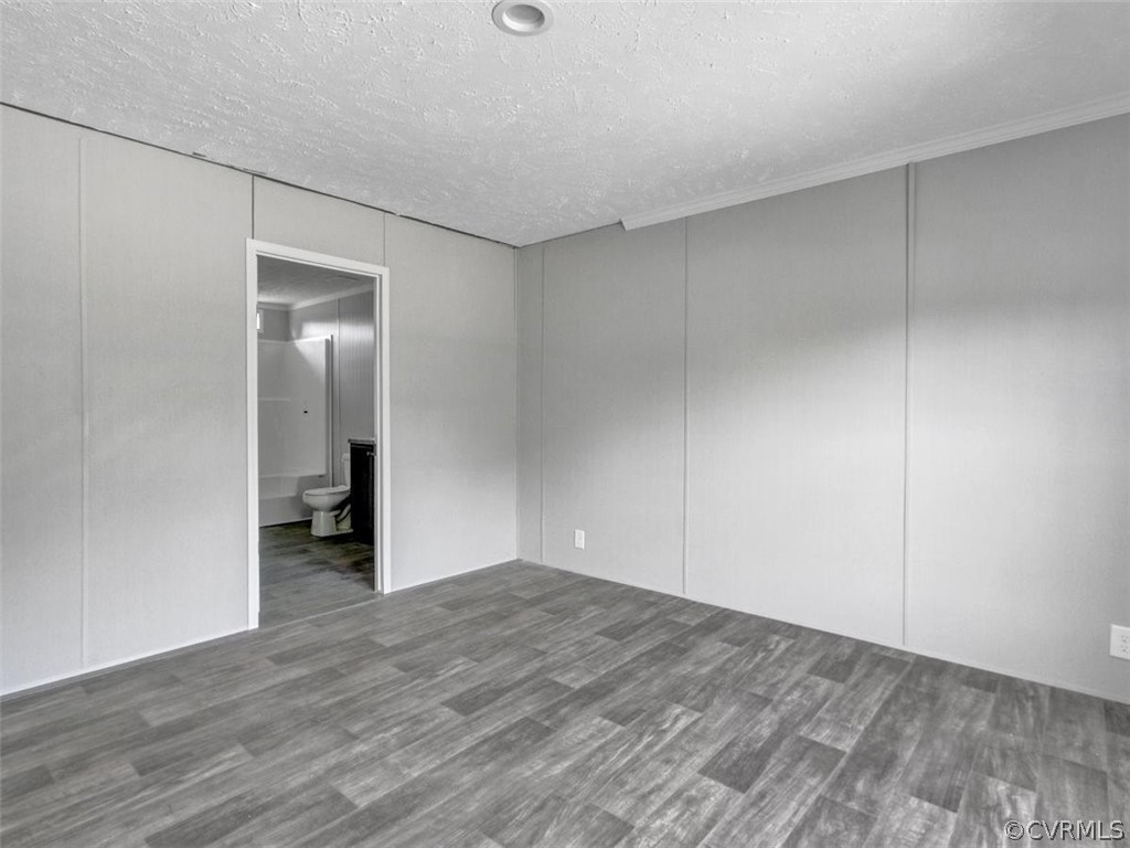 Tbd Railroad Avenue Dendron, VA 23839 - Photo 13 of 22 a view of an empty room with wooden floor and closet