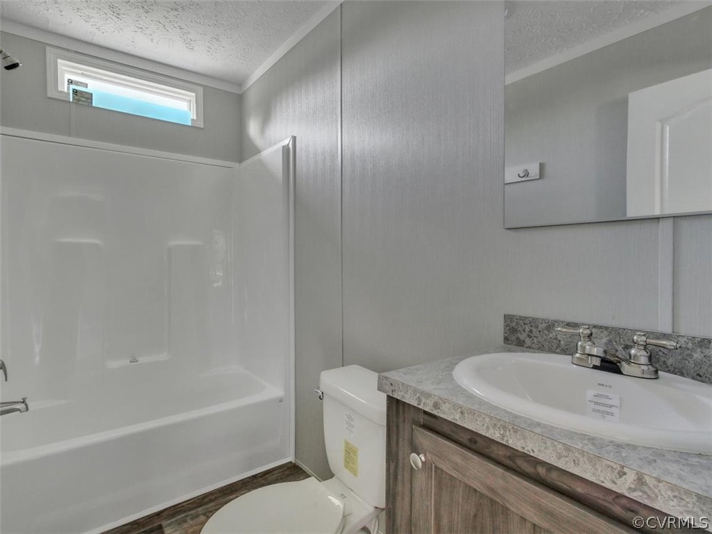 Tbd Railroad Avenue Dendron, VA 23839 - Photo 17 of 22 a bathroom with a granite countertop sink toilet and shower