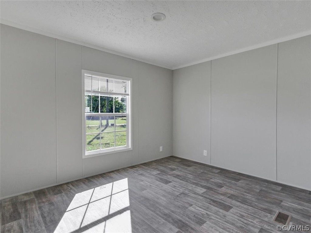 Tbd Railroad Avenue Dendron, VA 23839 - Photo 18 of 22 an empty room with wooden floor and windows