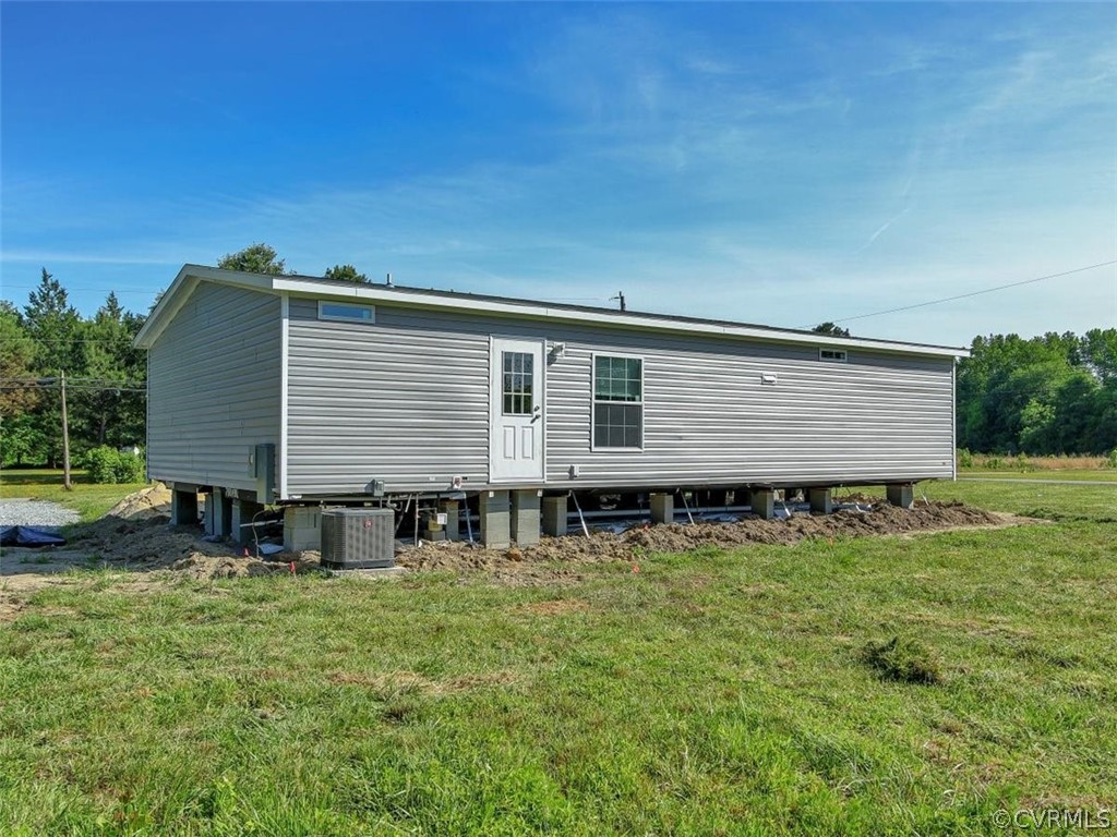 Tbd Railroad Avenue Dendron, VA 23839 - Photo 20 of 22 a front view of house with yard and seating area