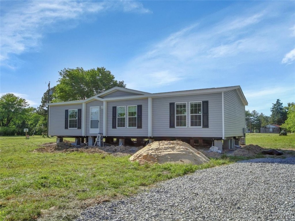 Tbd Railroad Avenue Dendron, VA 23839 - Photo 2 of 22 a front view of a house with garden