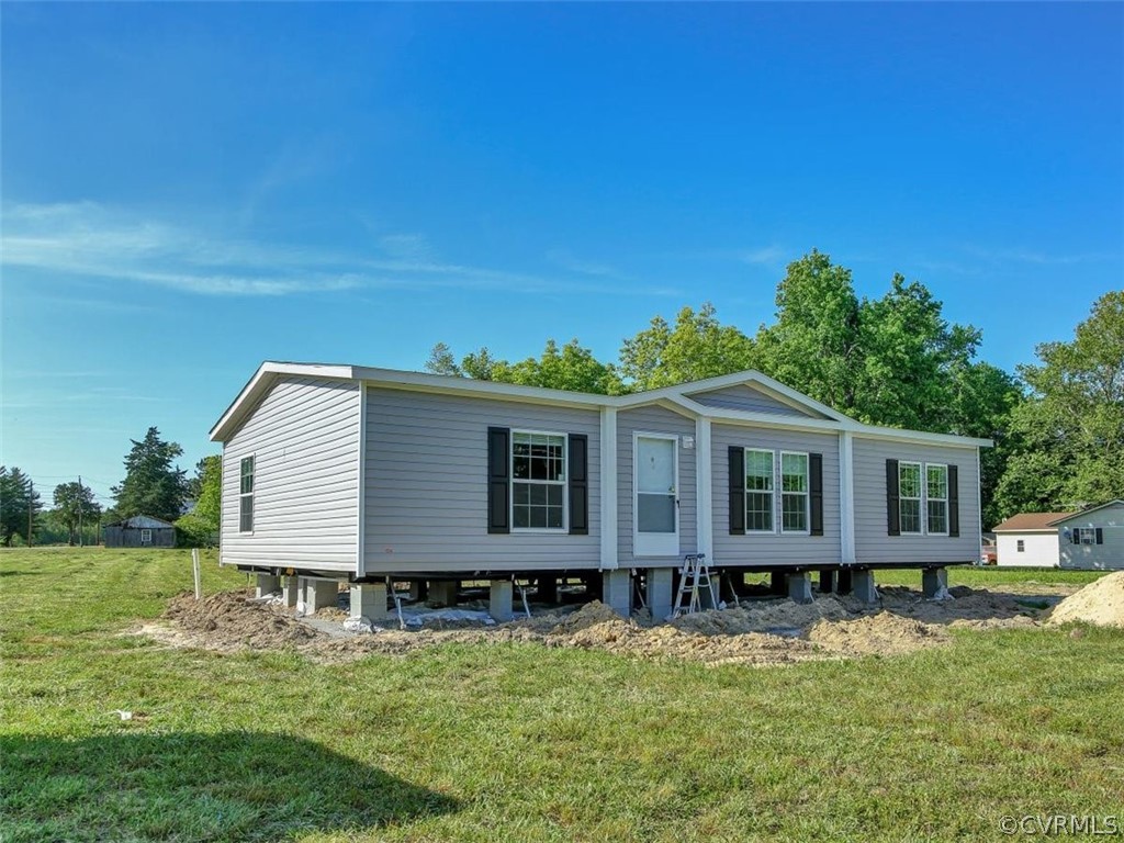 Tbd Railroad Avenue Dendron, VA 23839 - Photo 3 of 22 a front view of a house with a yard