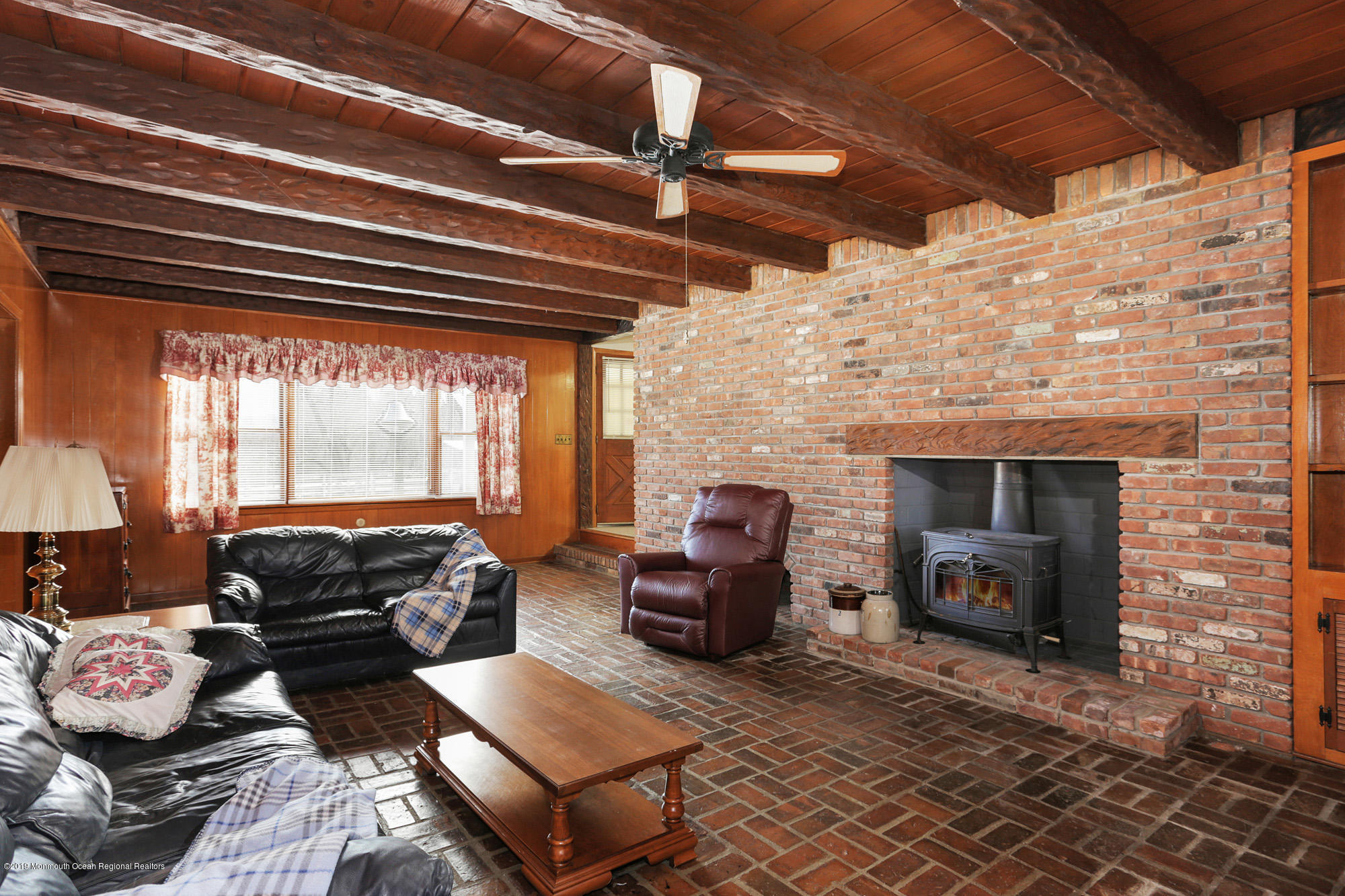 250 Newman Springs Road Colts Neck, NJ 07722 - Photo 12 of 43 a living room with furniture and a fireplace