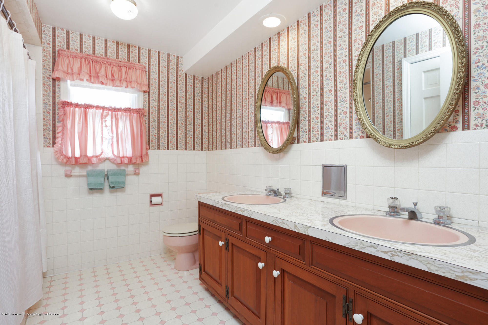 250 Newman Springs Road Colts Neck, NJ 07722 - Photo 19 of 43 a bathroom with a granite countertop double vanity sink a toilet and a mirror