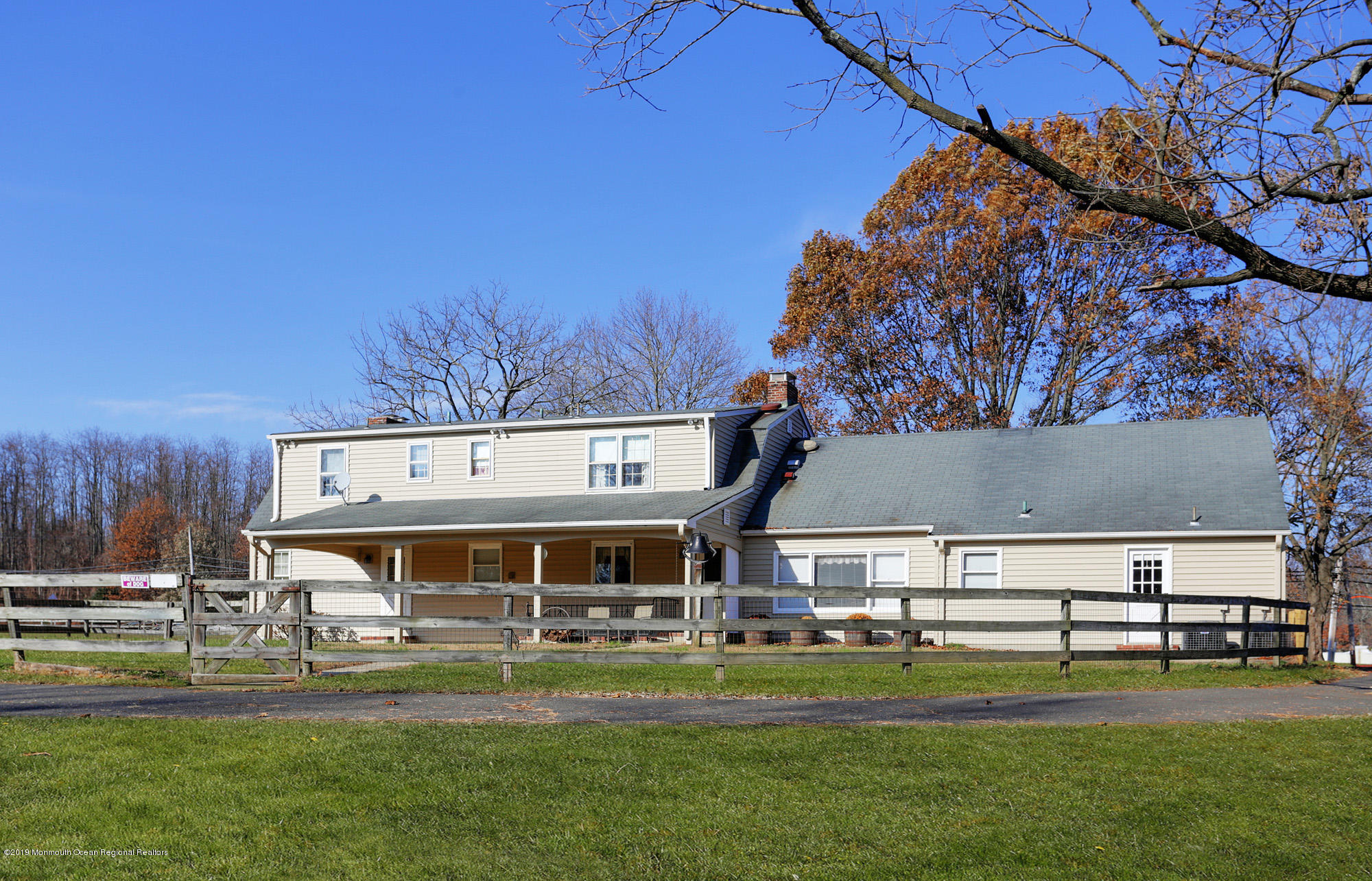 250 Newman Springs Road Colts Neck, NJ 07722 - Photo 29 of 43 a front view of a house with a yard table and chairs