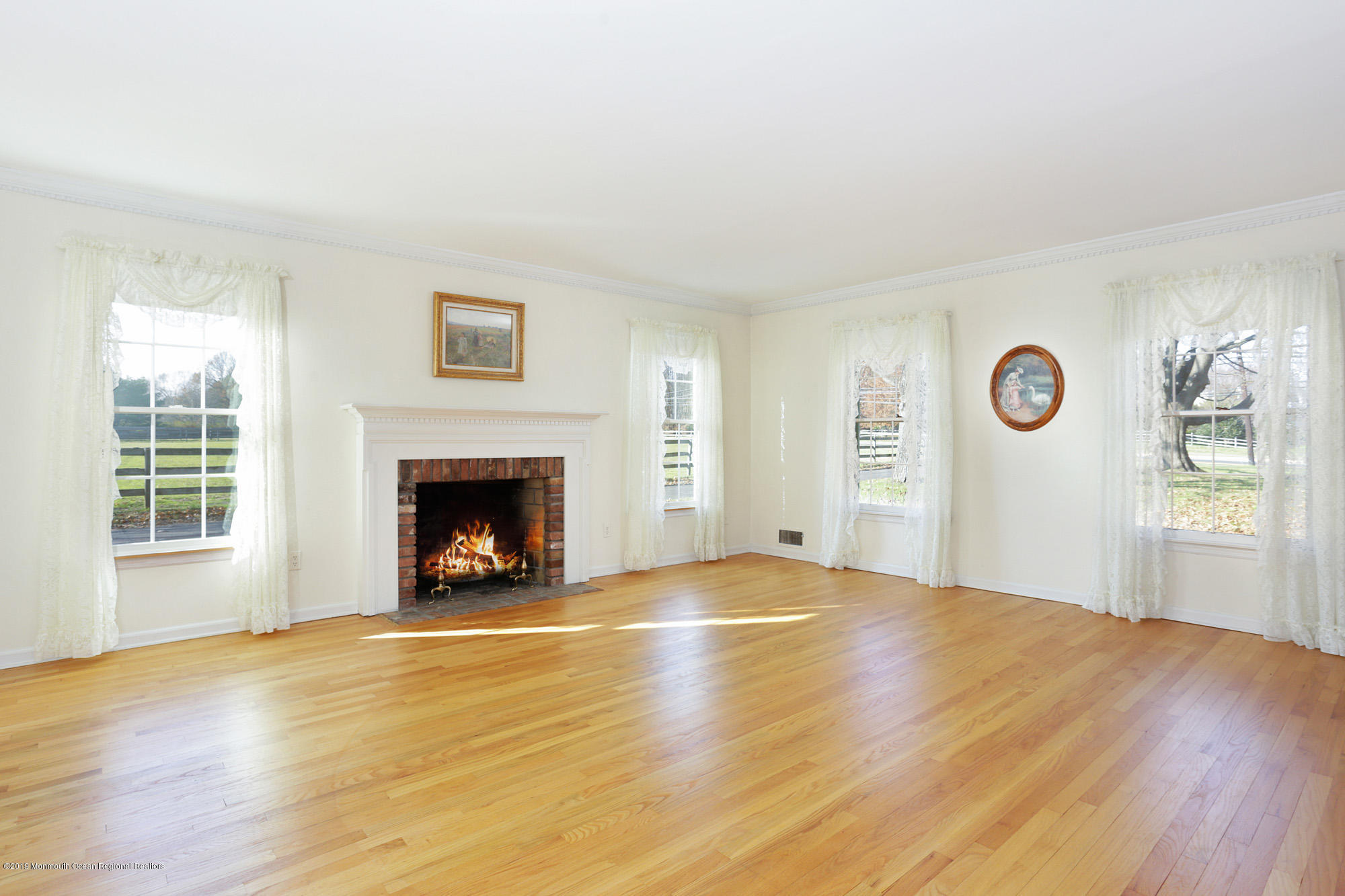 250 Newman Springs Road Colts Neck, NJ 07722 - Photo 7 of 43 a view of an empty room with a window and fireplace