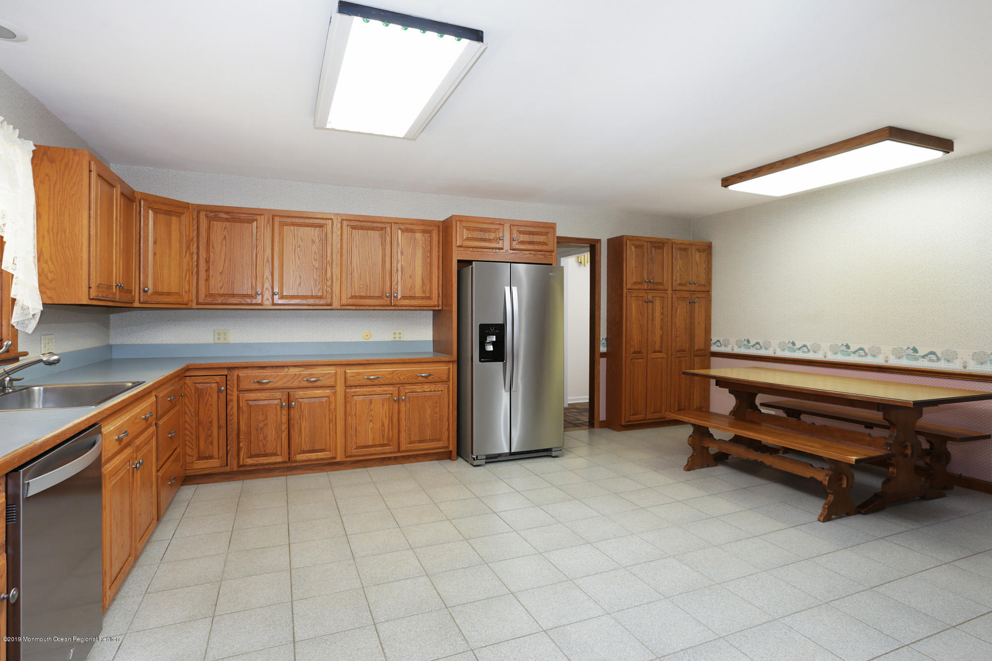 250 Newman Springs Road Colts Neck, NJ 07722 - Photo 10 of 43 a kitchen with stainless steel appliances a refrigerator and cabinets