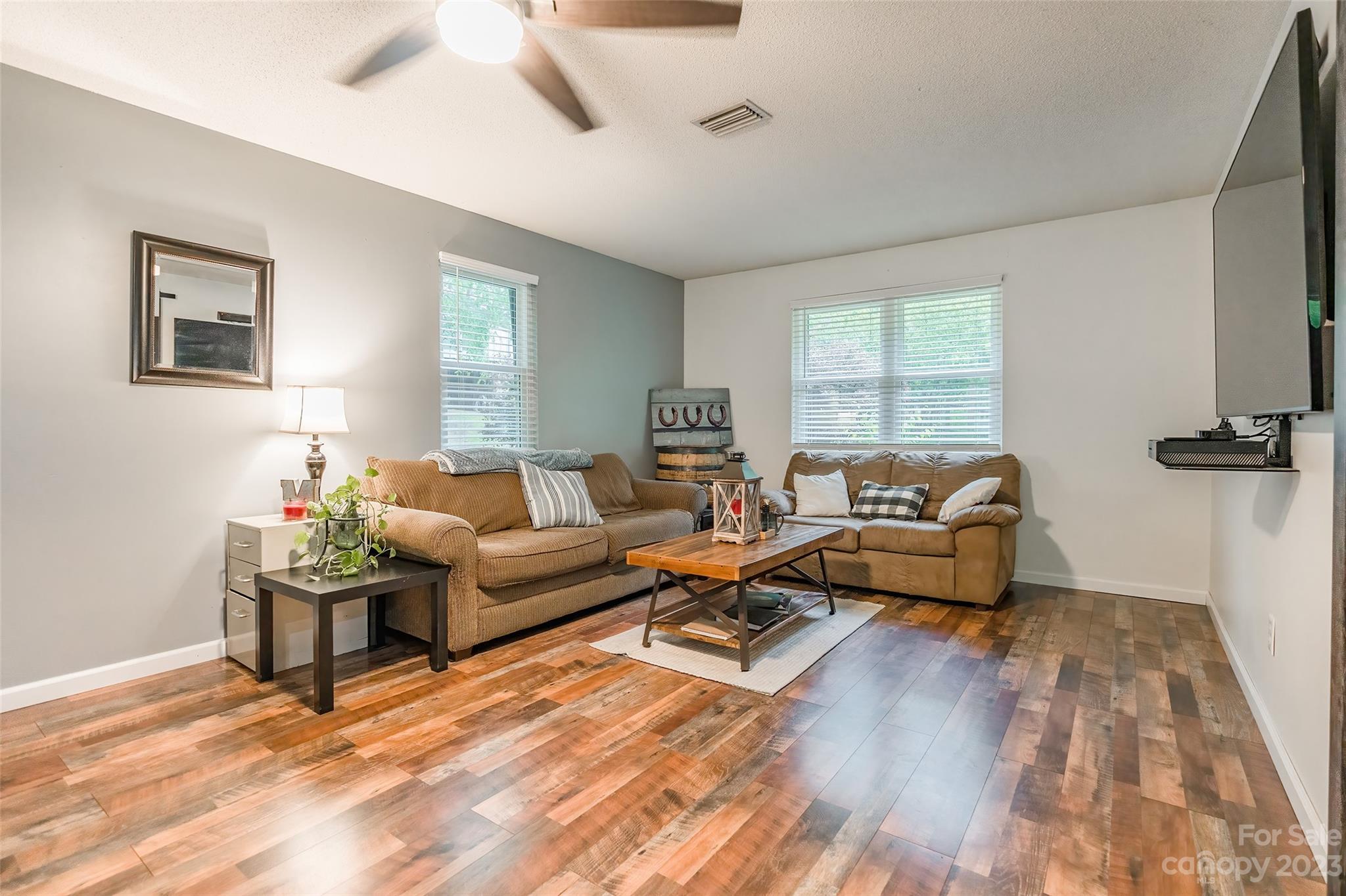 176 Hatchway Road Indian Land, SC 29707 - Photo 3 of 28 a living room with furniture and a wooden floor